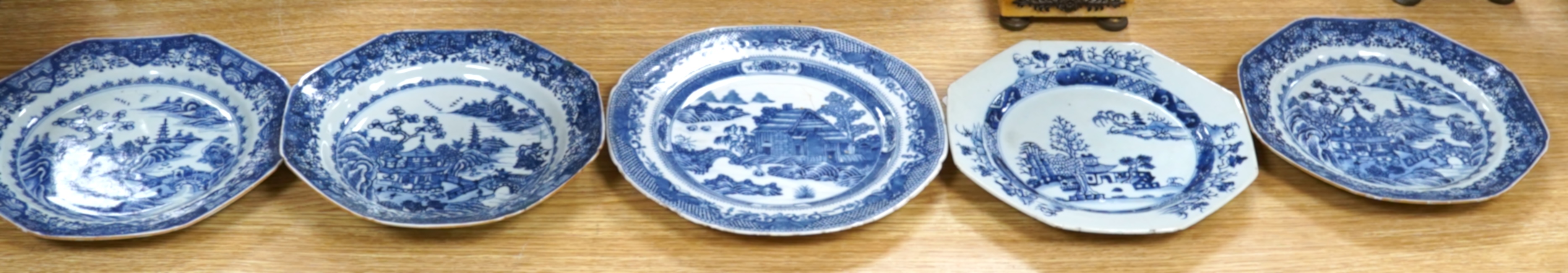 Five 18th century Chinese Export blue and white plates, largest 24cm diameter. Condition - all have varying amounts of damage